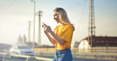 a girl standing and using mobile