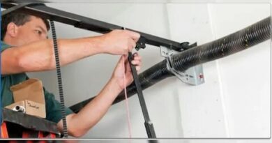 Garage door repair service in Maryland, showcasing a technician fixing a residential garage door.