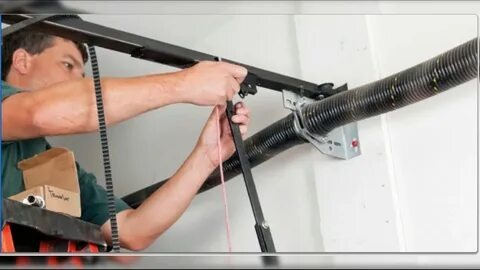 Garage door repair service in Maryland, showcasing a technician fixing a residential garage door.